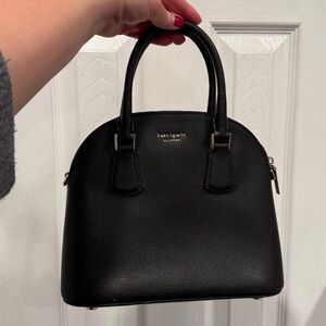 Black Kate Spade top handle purse.